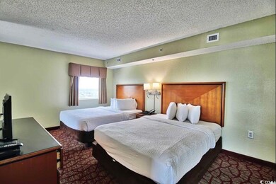 Bedroom with visible vents, carpet flooring, and b