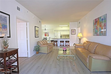 Living room with light wood finished floors, baseb