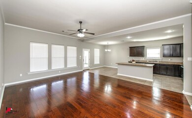 Unfurnished living room with dark hardwood / wood-