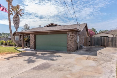 Extra Parking pad plus detached garage in back!