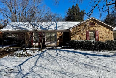 Single story home with brick siding