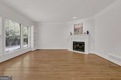 Expansive windows framed by built-in bookcases.