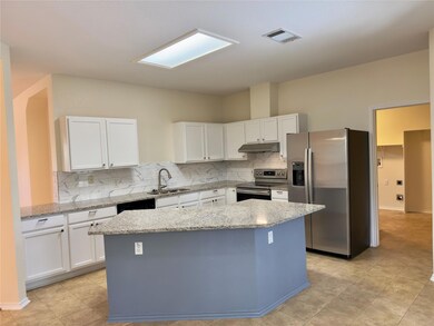 Kitchen featuring appliances with stainless steel