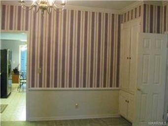 Dining room looking into kitchen.  This photo show