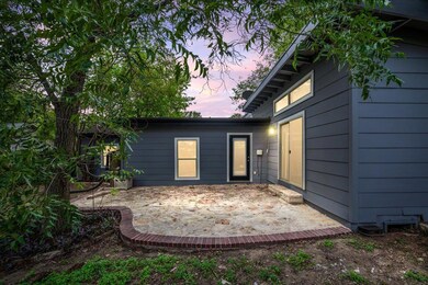 Rear view of property with a patio area