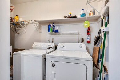 Laundry room with separate washer and dryer and la