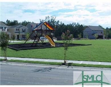 Exterior Front. play ground and greenspace