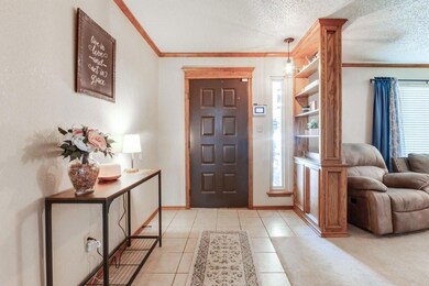 Foyer with a textured ceiling, plenty of natural l