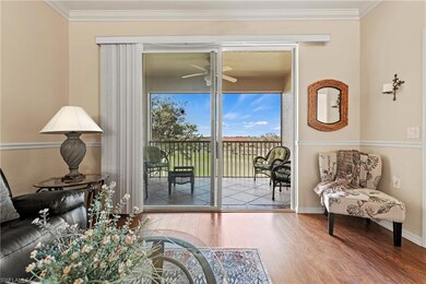 Doorway with ceiling fan, wood-type flooring, and 