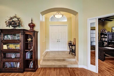 Front entrance  foyer and den view form living roo