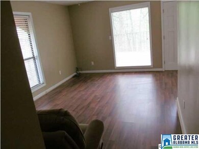 Living Room with wood floors & plenty of windows