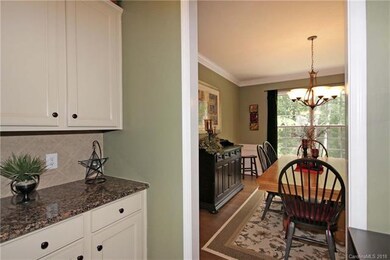 Butler pantry with granite counter and extra cabin