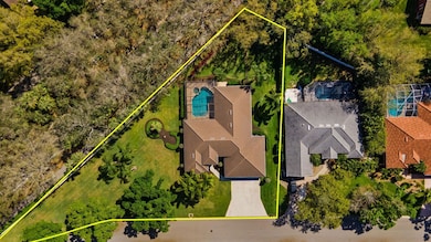 View from above of property featuring property parcel outlined and a pool area