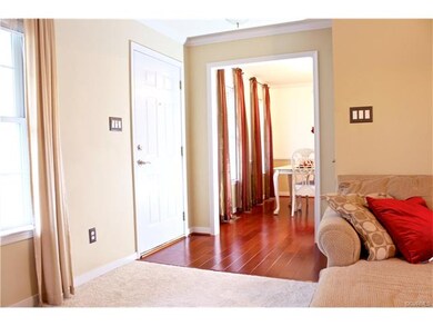 The Foyer features Wide Plank Cherry Wood Flooring
