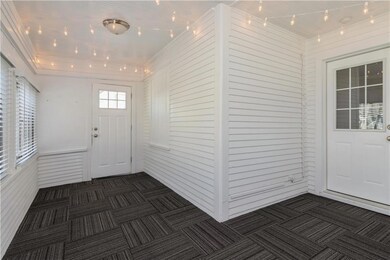 Spacious front porch with lights on dimmers