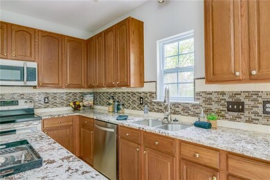 Updated Kitchen with gorgeous granite, backsplash and stainless appliances