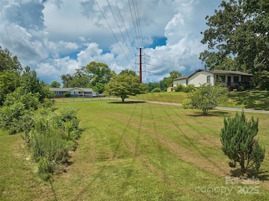 View of lot from Moody Ave with future shared driveway running along left side of photo