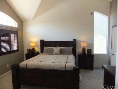 Master Bedroom features plantation shutters, neutr