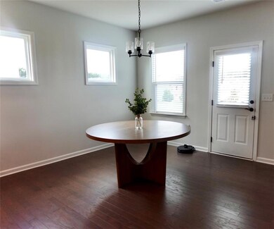 Unfurnished dining area featuring dark wood finish