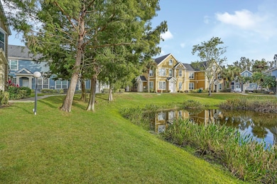 FRONT ENTRANCE AND POND