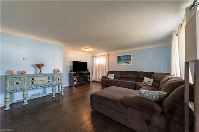 21' x 15' Living Room with freshly painted walls.