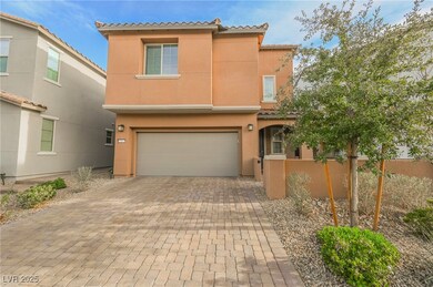 Mediterranean / spanish-style house with stucco siding, a tiled roof, decorative driveway, and a garage