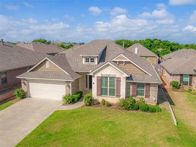 Craftsman-style house featuring a garage and a fro