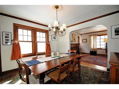 Dining room with built-ins, hard wood floors and crown molding.
