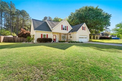 Traditional-style home featuring driveway, fence, 