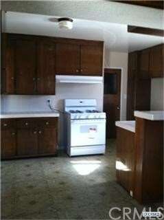 KITCHEN WITH NEW STOVE AND HOOD