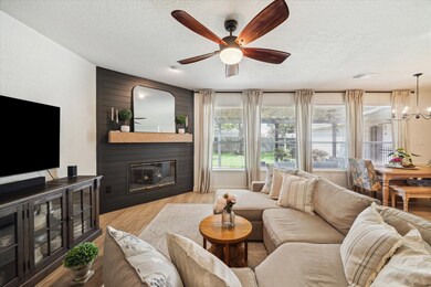 Charming family room featuring a painted shiplap f