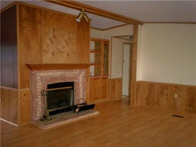 Living Room. Beautiful wood burning fireplace with