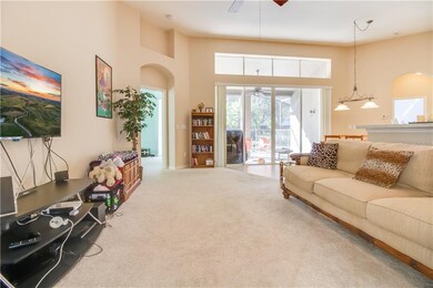 Open concept family room and kitchen with doors le
