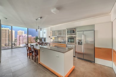 Kitchen with tile patterned floors, a city view, f