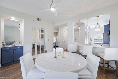 Dining room with visible vents, ceiling fan, and d