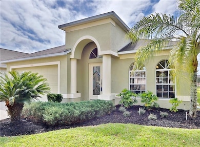 Love the arch entry and windows.
