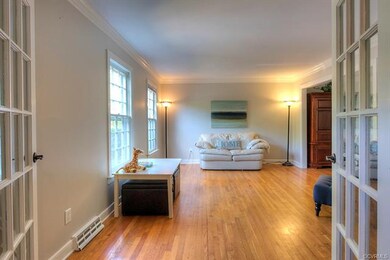 French doors open into the formal living room whic