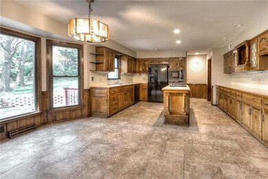 A spacious kitchen with a great view of the lush b