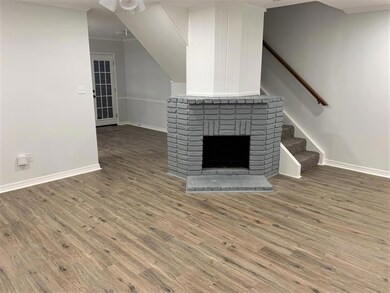 Living room with beautiful wood burning fireplace.