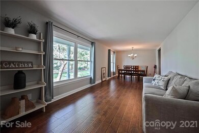 Living Room/Dining Room features plenty of natural light with large windows!