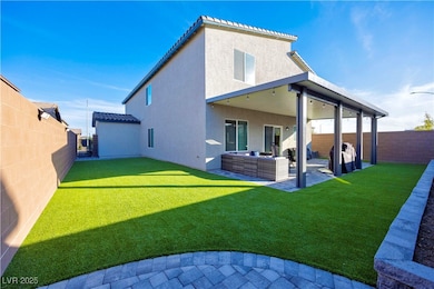 Rear view of house featuring a patio, a fenced backyard, stucco siding, an outdoor living space, and a tiled roof