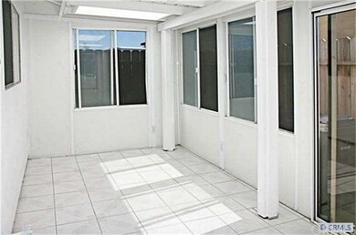 Wonderful Enclosed Patio with Tile Flooring and Sk