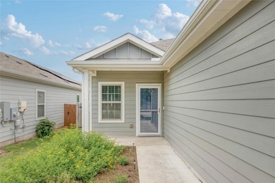 Doorway to property with board and batten siding