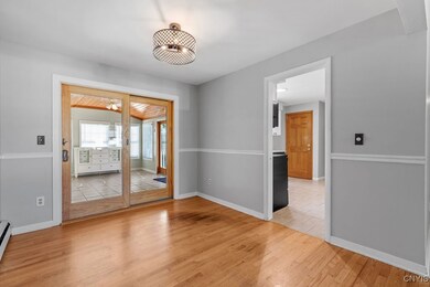 Sliding door leads to 3-season sun room
