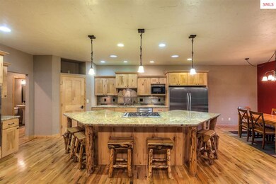 This kitchen holds a crowd with beautiful granite 