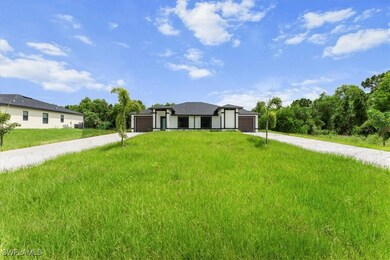 Prairie-style home with concrete driveway and a fr