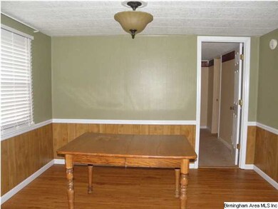 Formal Dining Room with HW floors and Updated ligh