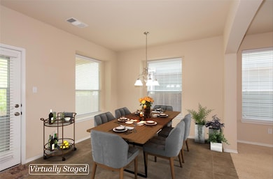 Tiled dining space featuring baseboards and visib
