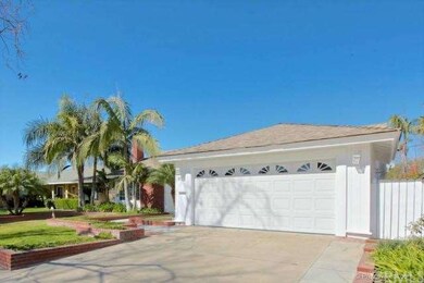 Attached garage view with roll up garage door, new