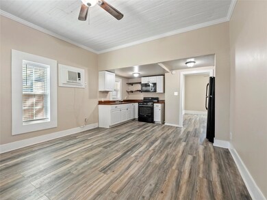 Kitchen with a healthy amount of sunlight, black a